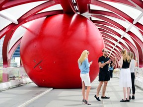 The Red Ball Project made its way to the Peace Bridge in Calgary, Alta., on June 26, 2017. The project is an art installation which has been making its way around the world for the last decade. Ryan McLeod/Postmedia Network
Ryan McLeod, Ryan McLeod/Postmedia Network
