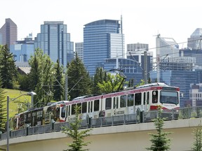 A CTrain rolls northwest out of downtown Calgary.