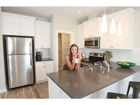 Carly Goheen in one of the new duplex show homes displayed by Slokker Homes in Georgetown at Reunion.