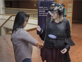 Angela Cabucos suits up Postmedia reporter Anna Junker in Ford's hangover suit.