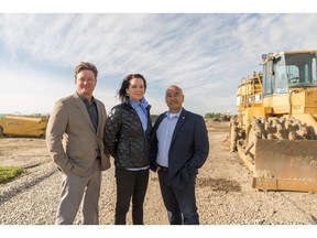 Chris Ollenberger of QuantumPlace Developments and Allison Harvie and Howard Tse of Cedarglen Homes at the future site of The Parks of Harvest Hills.