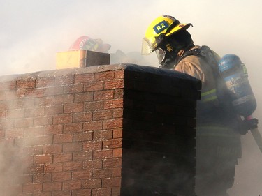 Fire crews battle a two-alarm blaze at  16 St. and 15 Ave. S.W. in the community of Sunalta Monday June 5, 2017 in Calgary, AB. DEAN PILLING/POSTMEDIA