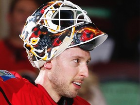The Flames traded Chad Johnson to Arizona Saturday for goalie Mike Smith.