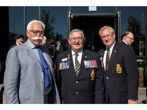 Truman Homes president George Trutina, and Legion members Bill Cox, president, and dominion treasurer Mark Barham at the opening of the new Legion building in Kensington by Truman Homes.