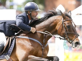 Rider, Richard Spooner from the USA riding Cristallo wins the CNOOC NEXEN Cup Derby at the Spruce Meadows National in Calgary on Sunday June 11, 2017. DARREN MAKOWICHUK/Postmedia Network