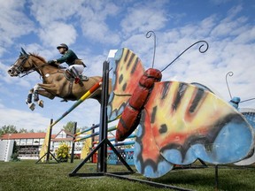 Paulo Santana of Brazil rides Taloubet in the CP International Grand Prix during the Masters tournament in 2014.