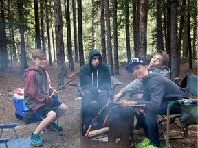 Penner Boys and Evan having fun around the fire.