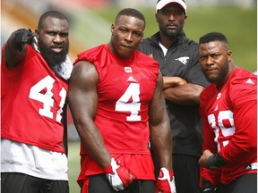 Calgary Stampeders L-R Cordarro Law, Micah Johnson and Charleston Hughes  pose for a pic during CFL training camp at McMahon stadium in Calgary on Wednesday, May 31, 2017.