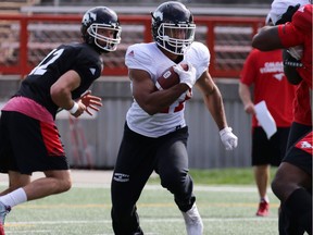 Calgary Stampeders running back Anthony Woodson runs the ball during training camp at McMahon Stadium in Calgary on Monday May 29, 2017.  Gavin Young/Postmedia Network