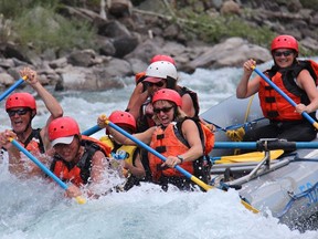 Rafters with Canyon Rafting Co. in Fernie B.C. hit some whitewater on the Elk River.
