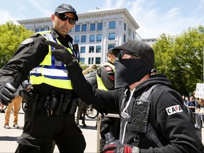 There was a large police presence as anti hate protesters confronted World Coalition against Islam members who held a rally at City Hall in Calgary on Sunday June 25, 2017. DARREN MAKOWICHUK/Postmedia Network