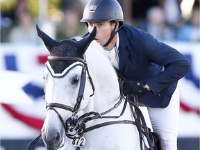 Rider Chris Surbey from Calgary riding Cavarola wins the RBC CAPITAL MARKETS Cup at the Spruce Meadows National in Calgary on Friday June 9, 2017.