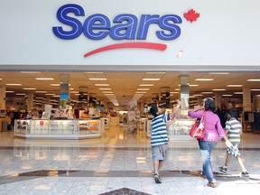 Customers walk into the Deerfoot Meadows Sears store on July 18, 2012. The store closed late that year.