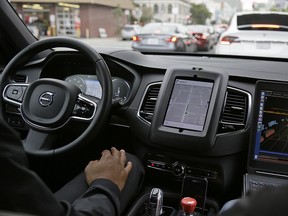 An Uber driverless car navigates traffic during a test drive in San Franciso recently. A University of Calgary study has determined that older males are more likely to try a driverless car.