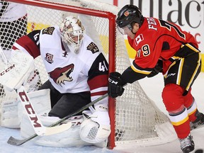 Micheal Ferland of the Calgary Flames tries a wrap around on Arizona Coyotes goalie Mike Smith during the second period at the Saddledome Wednesday November 16, 2016. (Ted Rhodes/Postmedia Calgary )
