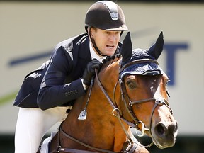 Rider McLain Ward from the USA riding HH Carlo Z in phase 2 of the ATCO Classic went on to win it with his Phase 1 run riding Tina La Boheme at the Spruce Meadows National in Calgary on Sunday June 11, 2017. DARREN MAKOWICHUK/Postmedia Network