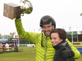 Rider Patricio Pasquel from Mexico riding Babel celebrates with his son after he wins the RBC Grand Prix at the Spruce Meadows National in Calgary which runs from June 7 to the 11th which runs from June 7 to the 11th on Saturday June 10, 2017. DARREN MAKOWICHUK/Postmedia Network