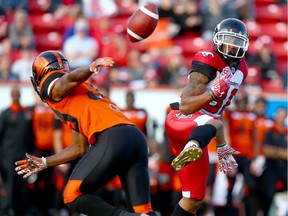 Calgary Stampeders receiver Jamal Nixon, right, can't handle the pass as B.C. Lions' Chandler Fenner moves in for the tackle during preseason CFL action  in Calgary on June 6, 2017.