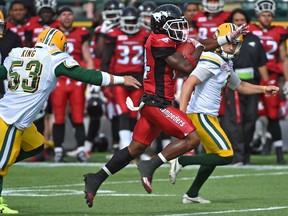 Calgary Stampeders Roy Finch (14) will score a touchdown on this punt return as Edmonton Eskimos try to purse during a preseason CFL game at Commonwealth Stadium in Edmonton, June 11, 2017. Ed Kaiser/Postmedia (Edmonton Journal story by Gerry Moddejonge) Photos for Gerry Moddejonge and Terry Jones copy running Monday, June 12.