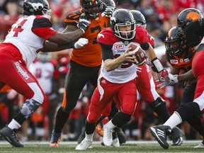 BC Lions' players chase Calgary Stampeders quarterback Andrew Buckley during CFL pre-season football action in Calgary, Tuesday, June 6, 2017.THE CANADIAN PRESS/Jeff McIntosh ORG XMIT: JMC108