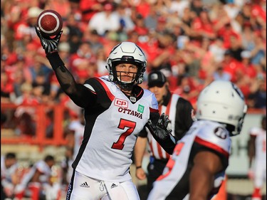 Ottawa Redblacks quarterback Trevor Harris throws a pass during the first half during of CFL action against the Calgary Stampeders at McMahon Stadium in Calgary on Thursday June 29, 2017. Gavin Young/Postmedia Network