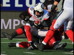 Ottawa Redblacks quarterback Trevor Harris is sacked in the first half during CFL action against the Calgary Stampeders at McMahon Stadium in Calgary on Thursday June 29, 2017. Gavin Young/Postmedia Network