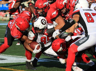 Ottawa Redblacks receiver Diontain Spencer is tackled during the first half of CFL action against the Calgary Stampeders at McMahon Stadium in Calgary on Thursday June 29, 2017. Gavin Young/Postmedia Network