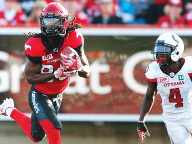 Calgary Stampeders Marken Michel with touchdown catch against Jerrell Gavins of the Ottawa Redblacks during CFL football in Calgary. AL CHAREST/POSTMEDIA