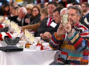 Canadian businessman and well known philanthropist W. Brett Wilson shoots on his smartphone during the third annual Breakfast on the Bridge event on Saturday June 17, 2017 in Calgary. The event takes place every two years, at sunrise, rain or shine, on the Peace Bridge and raises funds and awareness for the Calgary Military Family Resource Centre. Jim Wells//Postmedia