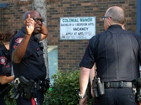 Police investigate a shooting in Sunalta on Tuesday, June 27, 2017.