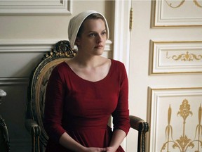 This image released by Hulu shows Elisabeth Moss as Offred in a scene from, "The Handmaid's Tale. Hulu announced Wednesday that the series based on Margaret Atwood's award-winning dystopian novel has been renewed for a second season. THE CANDIAN PRESS, AP- George Kraychyk/Hulu ORG XMIT: CPT106