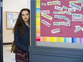 This image released by Netflix shows Katherine Langford in a scene from the series, "13 Reasons Why," about a teenager who commits suicide. T