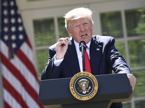 US President Donald Trump announces his decision on the Paris Climate Accords in the Rose Garden of the White House in Washington, DC, on June 1, 2017.      /