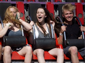 Jilin Gasser, left, Kellie Newell and Andrew Kapusin enjoy the rides during Sneak-a-Peek at the Calgary Stampede on Thursday July 6, 2017. Leah Hennel/Postmedia

Stampede2017
Leah Hennel, Leah Hennel/Postmedia