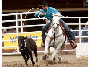 Logan Bird of Nanton, Alberta during tie-down roping at the Calgary Stampede on Saturday July 15, 2017.