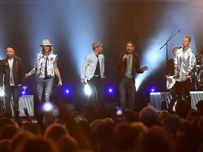 FILE - In this April 2, 2017 file photo, Tyler Hubbard, from right, and Brian Kelley, third from left, of Florida Georgia Line, and from left, Nick Carter, AJ McLean, Brian Littrell, and Kevin Richardson, of Backstreet Boys, perform at the 52nd annual Academy of Country Music Awards in Las Vegas. Backstreet Boys got their first hit country song this year on a collaboration with country duo Florida Georgia Line and now the two powerhouse acts are teaming up for a ‚ÄúCMT Crossroads‚Äù episode airi