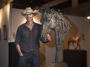 British Columbia-based artist James Stewart is pictured with "Mustang," his 4.5 foot bronze sculpture. Stewart's work is on display in the Western Showcase artist studios at the 2017 Calgary Stampede. For Stampede story by Eric Volmers. KERIANNE SPROULE/POSTMEDIA

Postmedia Calgary Stampede2017