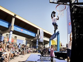 Acrodunk performer Richard Smith (aka Rich Boy Live) leaps over the head of little Lola Mifflin, 8, in an afternoon performance at the Calgary Stampede on Thursday, July 13, 2017. For Stampede story by Anna Junker. KERIANNE SPROULE/POSTMEDIA

Postmedia Calgary Stampede2017
Kerianne Sproule