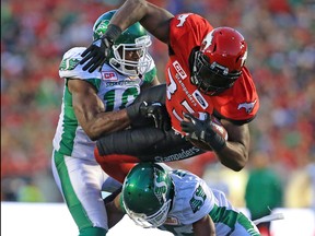 The Calgary Stampeders' Jerome Messam drives for the goal line during CFL action against the Saskatchewan Roughriders in Calgary on Saturday July 22, 2017. Message scored a touchdown on the next play.