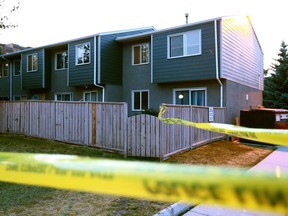 Calgary police on the scene at a townhouse complex on 90th Avenue S.E. on July 18, 2017.