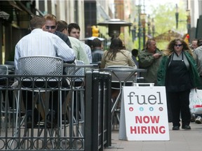 Office workers walk past for hire signs outside a restaurant along a downtown mall in Calgary,. Alberta's energy fueled economy is expected to expand about 50 per cent fast than the rest of Canada this year, prompting some of the province's 3.9 million residents to wonder when the boom will benefit them. Photographer: Dave Olecko/Bloomberg News.
DAVE OLECKO, BLOOMBERG NEWS