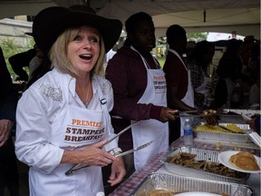 Rachel Notley

Alberta Premier Rachel Notley serves up pancakes at the Premier's annual Stampede breakfast in Calgary, Alta., Monday, July 10, 2017.THE CANADIAN PRESS/Jeff McIntosh ORG XMIT: JMC107
Jeff McIntosh,