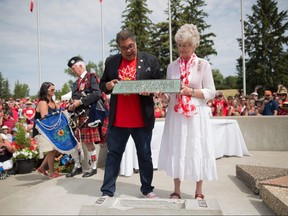 Mayor Naheed Nenshi and IODE member Shirley Lamonte pose with the plaque from a time capsule which was buried in 1967 and opened on July 1st, 2017 at Calgary's Confederation Park. Andy Nichols/Postmedia