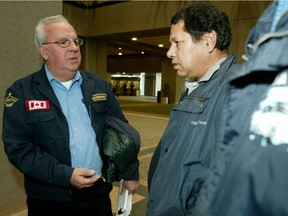 Harjit Seroya (r) shown here in 2007, is seeking damages of $1 million, for the loss of five plates, or TPLs, he accumulated between 1986 and 2002. (Postmedia)