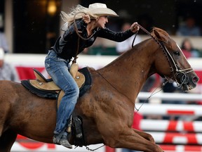 Tiany Schuster of Krum, Texas, during her winning ride in barrel racing at the Calgary Stampede on Sunday July 16, 2017.