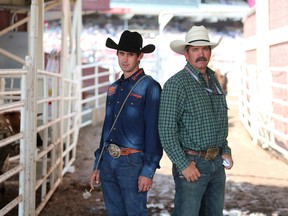 Tie-down roper Logan Bird, left and his dad Manerd at the Calgary Stampede on Wednesday July 12, 2017. Leah Hennel/Postmedia