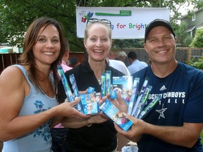 Tennille Cooper, Dr, Sarah Halland and Paul Kerber hold toothbrushes, toothpaste and floss that they will to give to at-risk CBE kids as part of the Brushing For Brightness Program.Wednesday July 12, 2017 in Calgary
