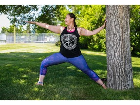 Yoga instructor Johanna Steinfeld demonstrates the virabhadrasana II / warrior 2 with tree support pose.