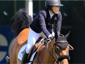 Karen Polle jumps Little Lord 90 in the McNerney Family U25 event at the Spruce Meadows North American on Friday July 7, 2017.