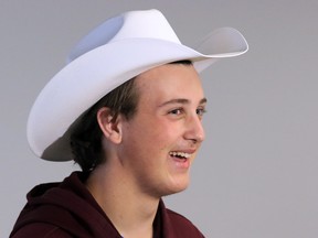 Brian Smith arrives at the Calgary International Airport and is "white-hatted" on Monday. The 16 year-old cancer survivor and his family are visiting the Rockies and the Calgary Stampede as guests of the Children's Wish Foundation of Canada.